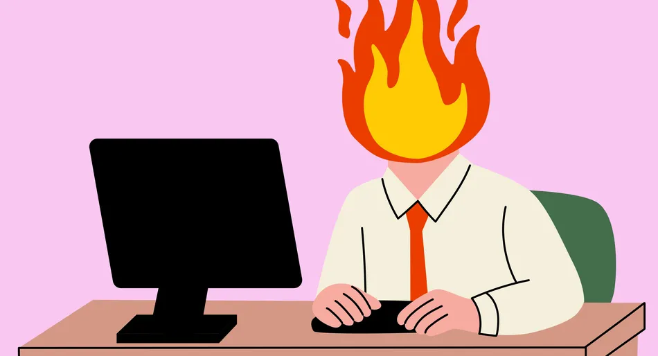 Personne travaillant à l'ordinateur avec la tête en feu